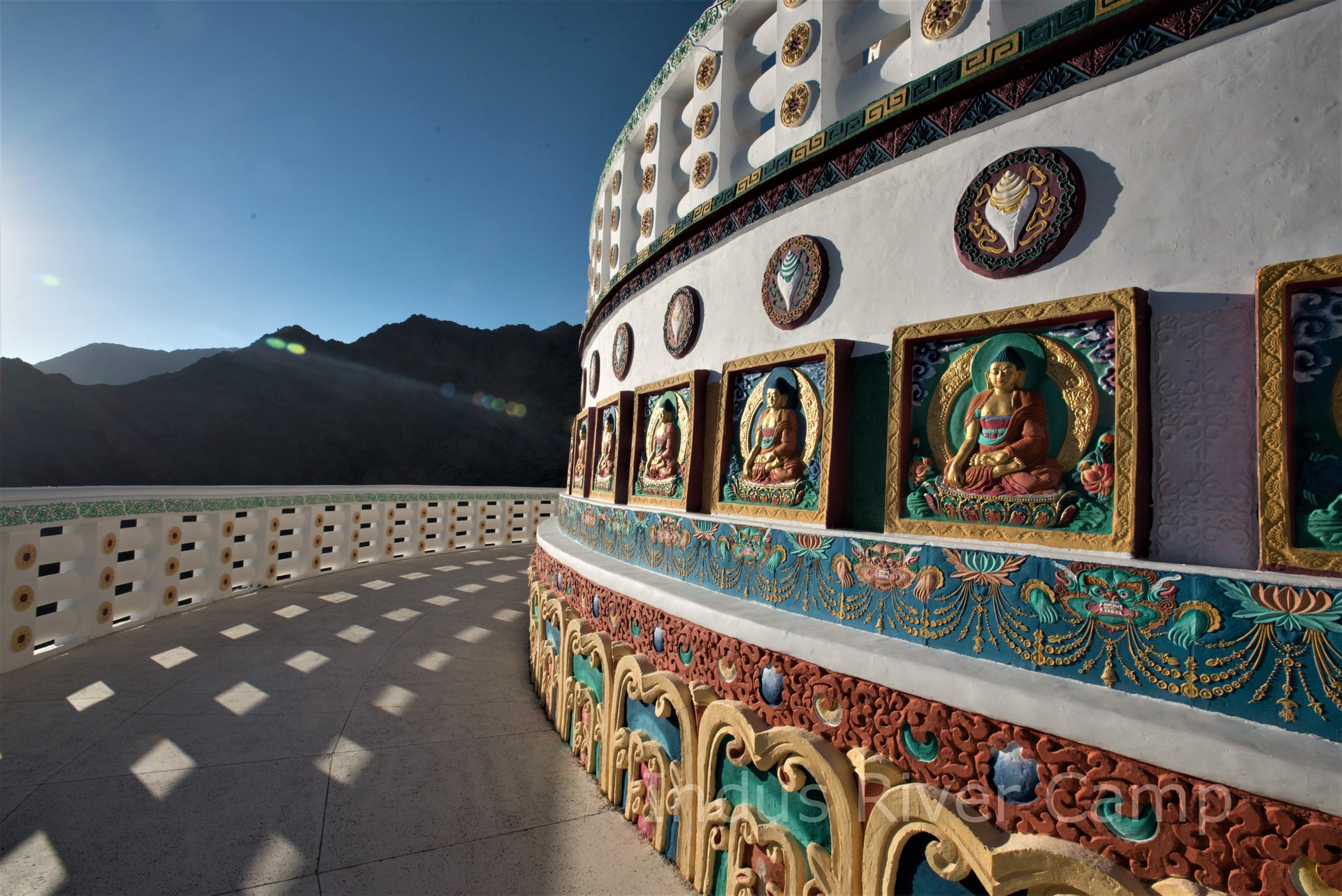 Prayer flags and monastery on hillside